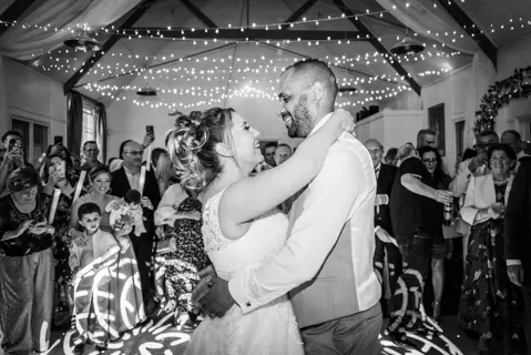 The bride and groom celebrate with their first dance