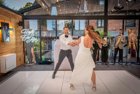 The Bride and Groom dance their first dance with flair at the Buttery and Glasshouse