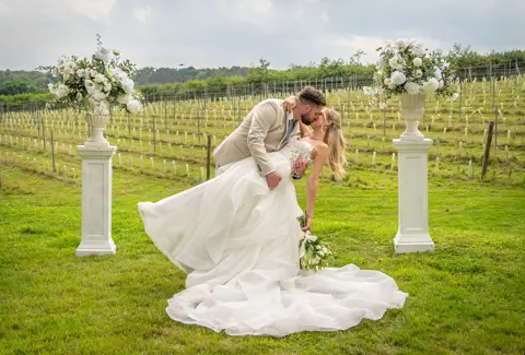 Getting swept off her feet at a Seddlescome Vineyard Wedding