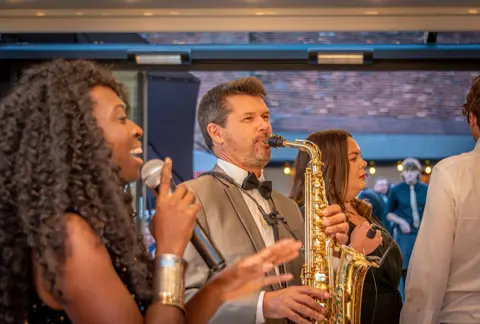 Saxophone player in the live wedding band at The Buttery and Glasshouse
